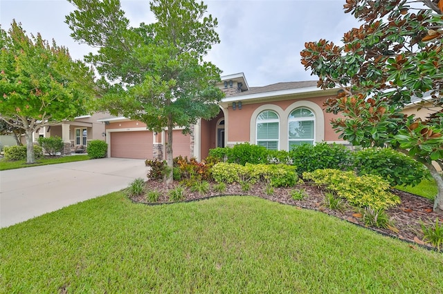 view of front facade featuring a front yard and a garage