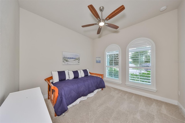 carpeted bedroom featuring ceiling fan