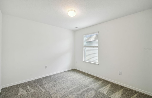 unfurnished room featuring carpet floors