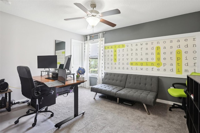 carpeted home office with ceiling fan