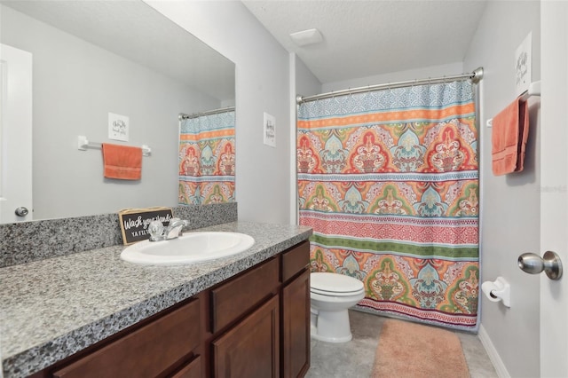 bathroom featuring vanity, curtained shower, a textured ceiling, and toilet