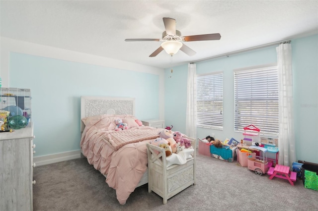 bedroom with ceiling fan and light carpet