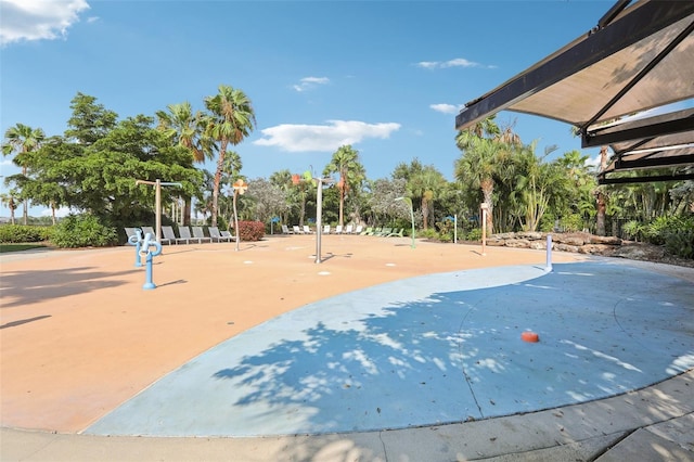 view of community with basketball hoop