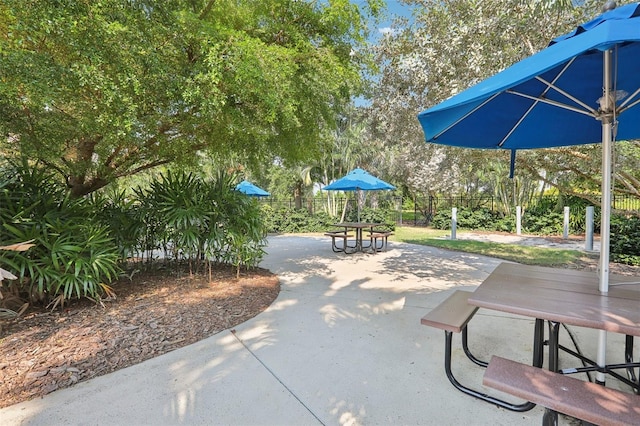 view of home's community with a patio area