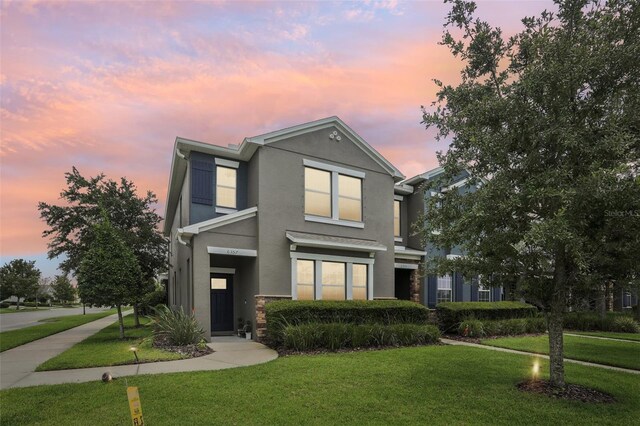 view of front of home with a lawn