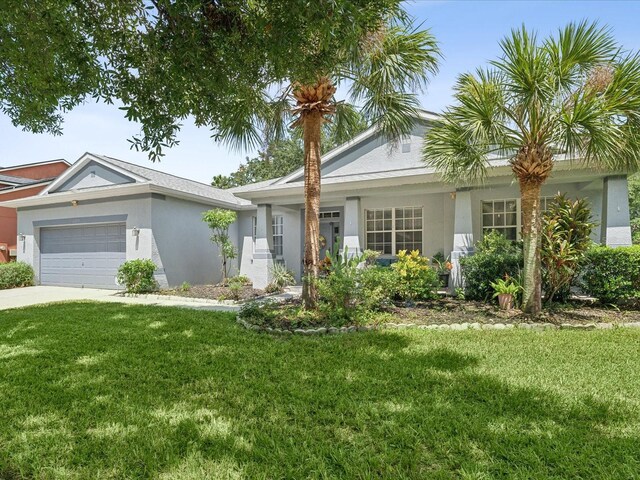 single story home with a front yard and a garage