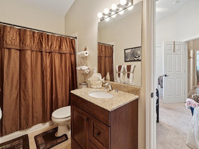 bathroom featuring vanity and toilet