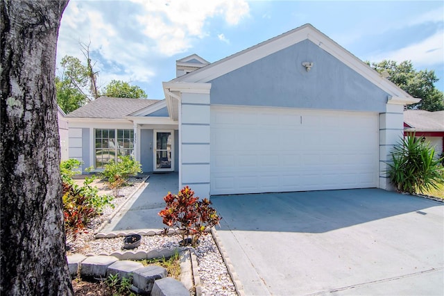 ranch-style home featuring a garage