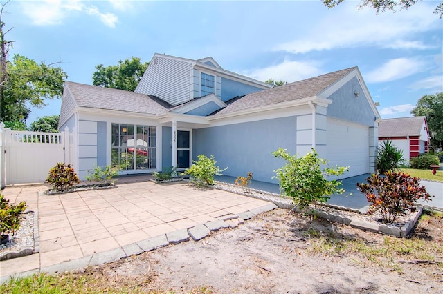 front facade with a garage