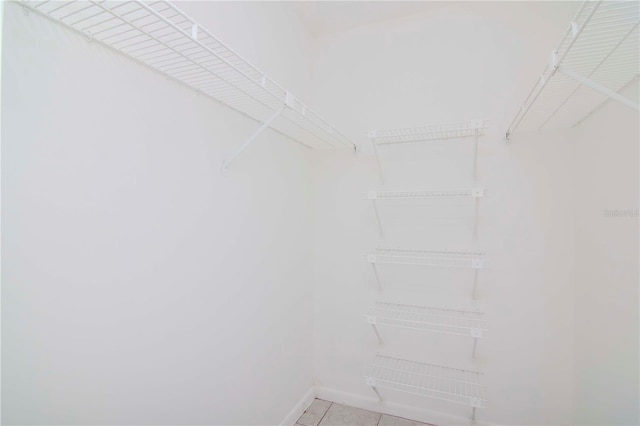 walk in closet featuring light tile patterned floors