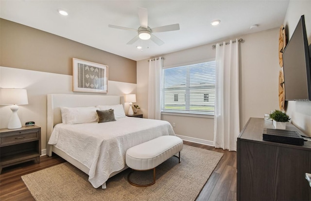 bedroom with ceiling fan and dark wood-type flooring