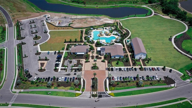 birds eye view of property with a water view