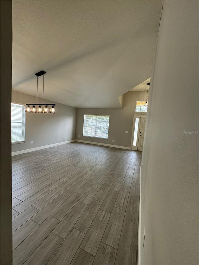 unfurnished living room with hardwood / wood-style flooring