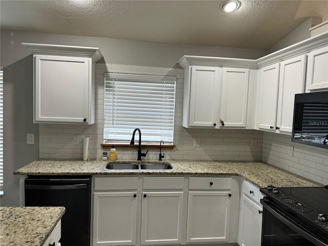 kitchen with tasteful backsplash, sink, and black appliances