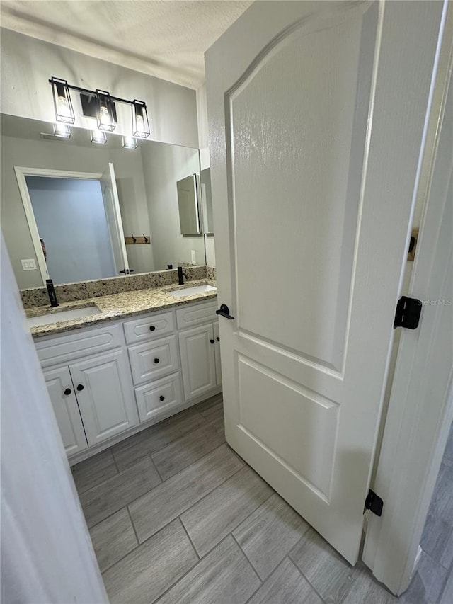 bathroom with double vanity and tile patterned floors