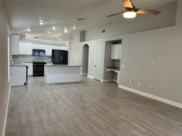 kitchen featuring ceiling fan, sink, black appliances, and white cabinetry