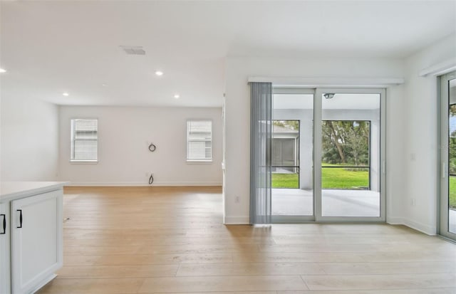 doorway with light hardwood / wood-style floors