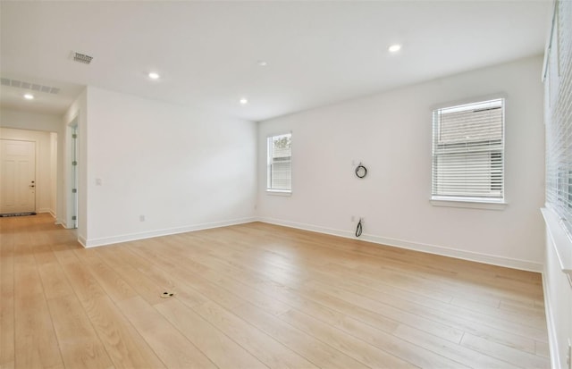 empty room with light hardwood / wood-style floors