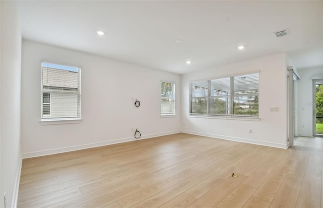 empty room with light hardwood / wood-style floors