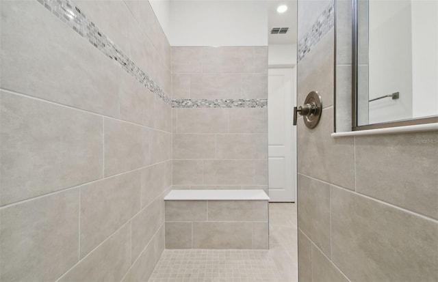 bathroom featuring tiled shower