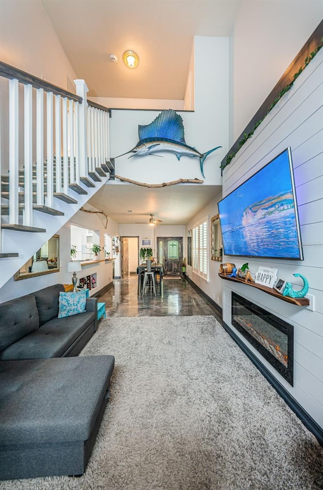 living room with a high ceiling