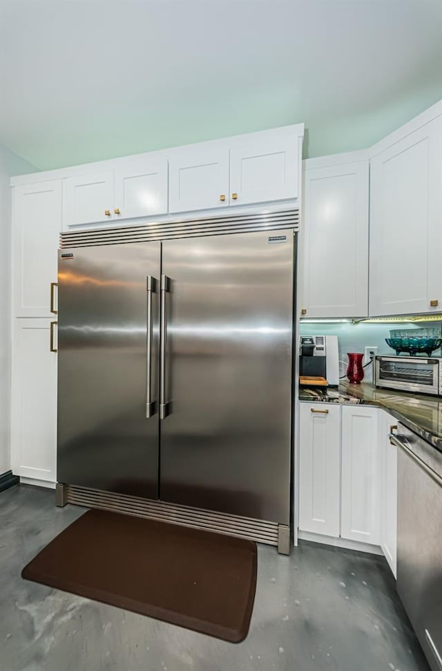 kitchen featuring appliances with stainless steel finishes and white cabinets