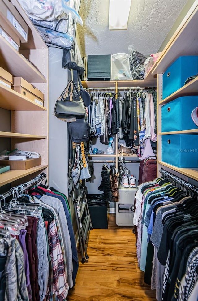 walk in closet featuring hardwood / wood-style floors