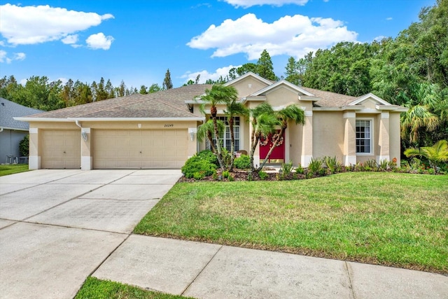 ranch-style house with a front lawn and a garage