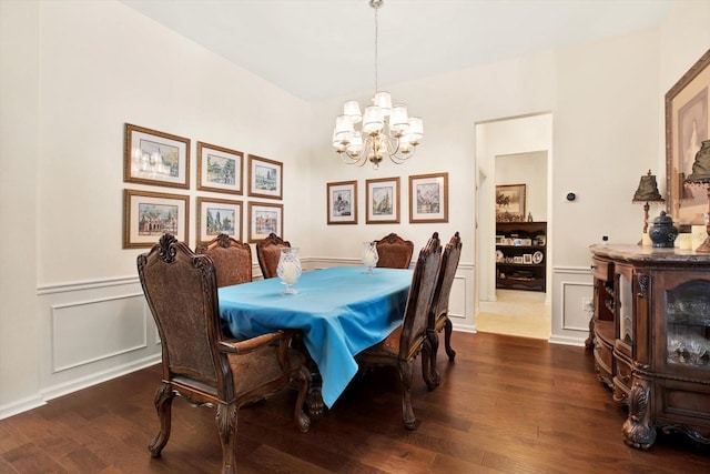 dining space featuring a chandelier and dark hardwood / wood-style floors