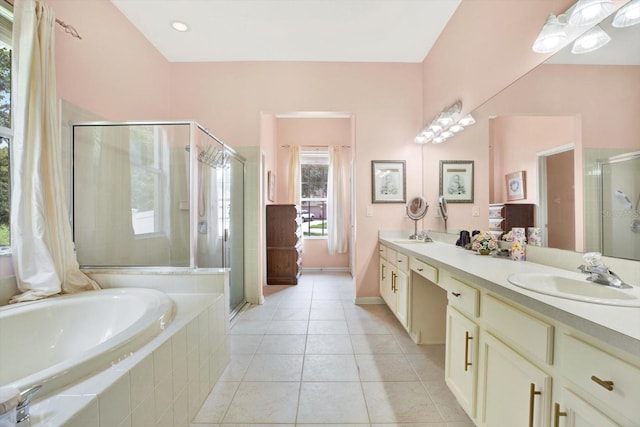 bathroom with separate shower and tub, a wealth of natural light, and vanity