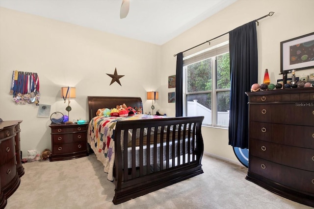 bedroom with light carpet and ceiling fan