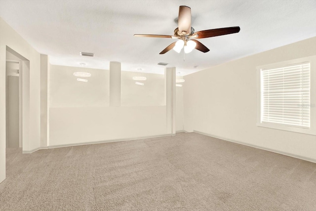 unfurnished room featuring ceiling fan and carpet floors