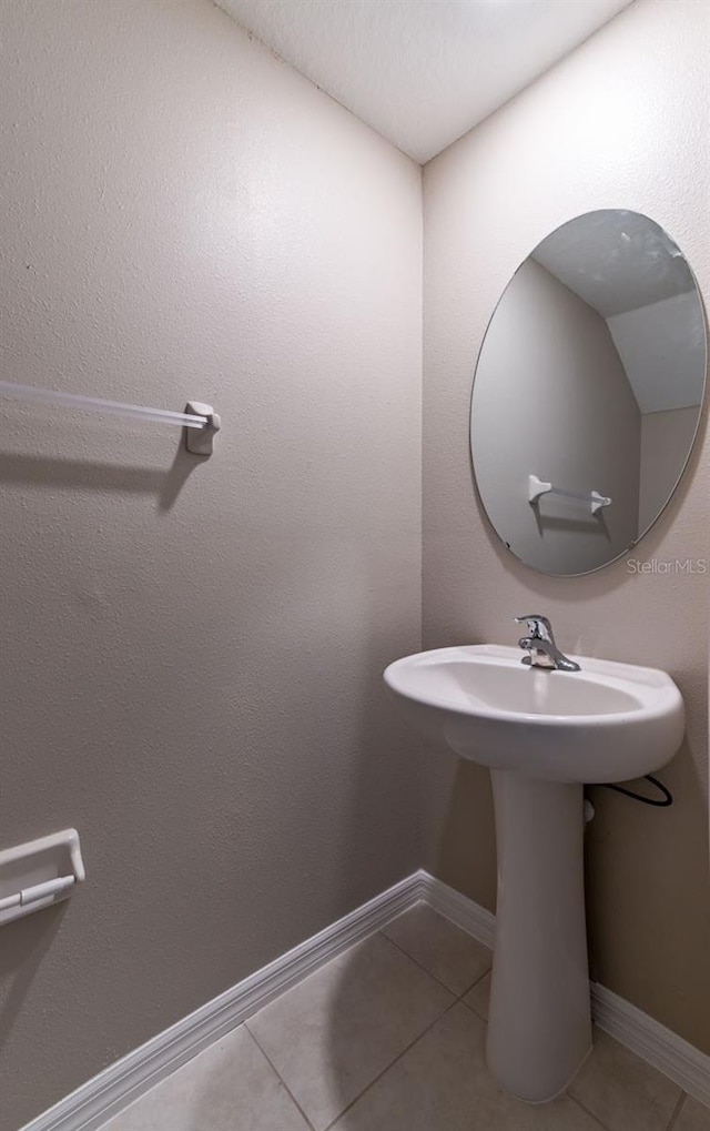 bathroom with tile patterned flooring