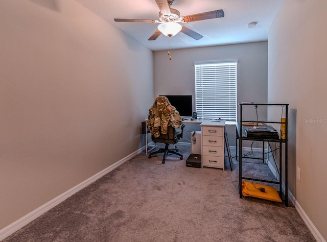 home office with ceiling fan and light carpet