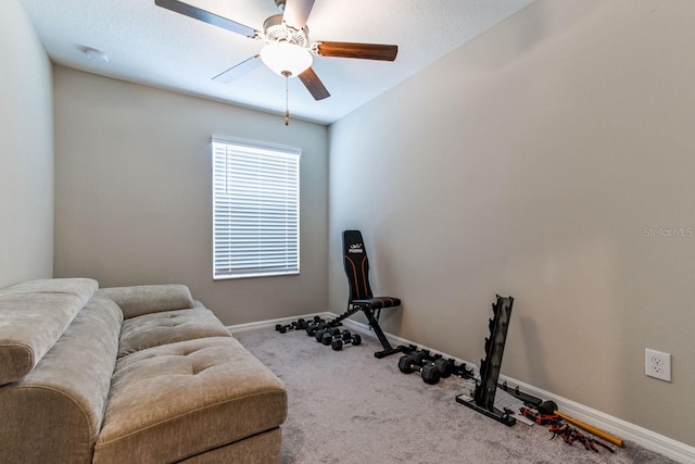 workout room with ceiling fan and carpet floors