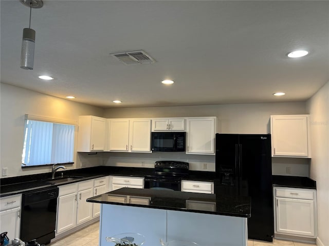 kitchen with sink, decorative light fixtures, black appliances, and white cabinets