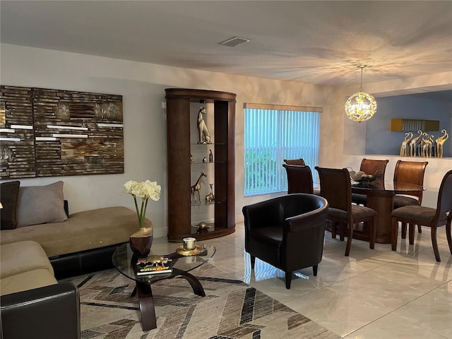 living room with an inviting chandelier