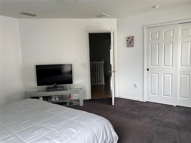 bedroom featuring dark colored carpet