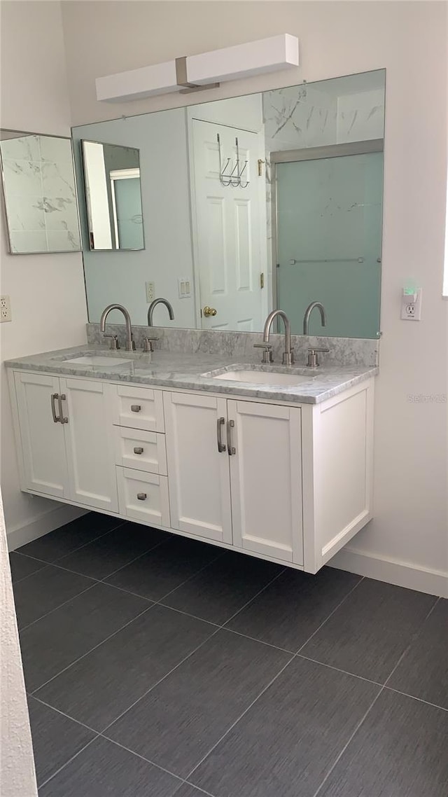 bathroom with vanity and tile patterned floors