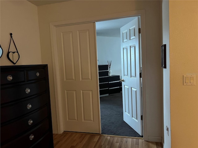 corridor featuring light hardwood / wood-style flooring