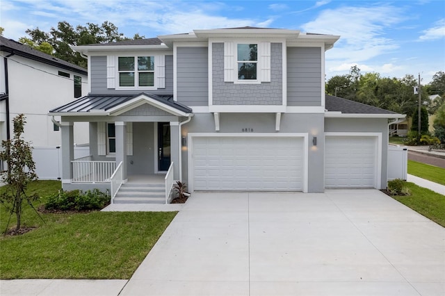 view of front of home with a garage and a front yard