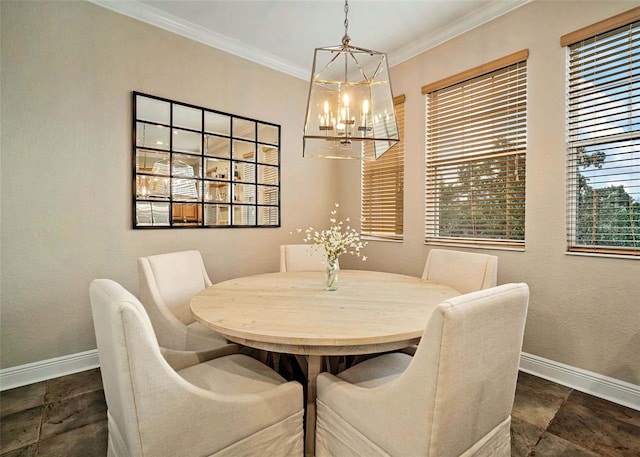 dining area with ornamental molding and a chandelier