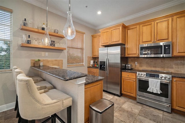 kitchen featuring pendant lighting, stainless steel appliances, tasteful backsplash, a kitchen bar, and ornamental molding