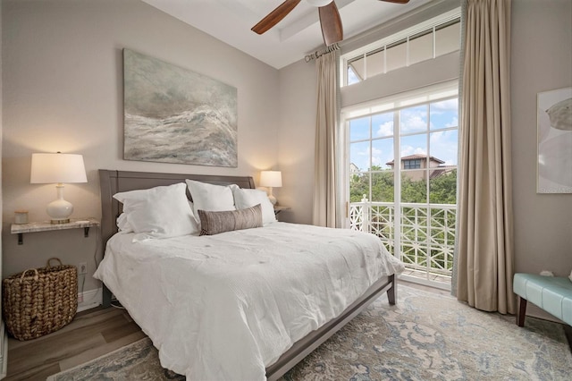 bedroom with ceiling fan and wood-type flooring