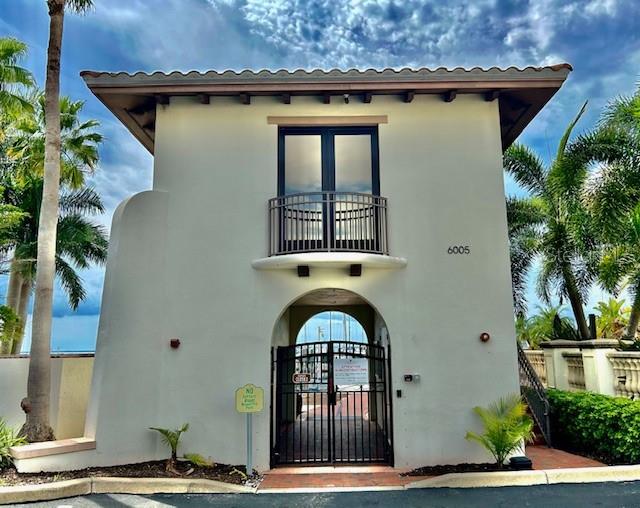 mediterranean / spanish-style home featuring a balcony