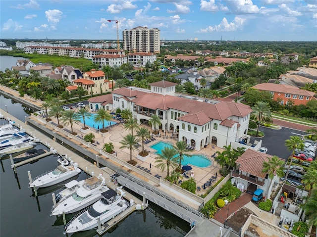 birds eye view of property with a water view