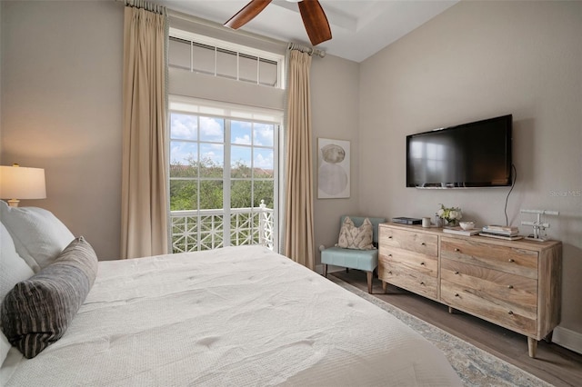 bedroom with ceiling fan and dark hardwood / wood-style flooring