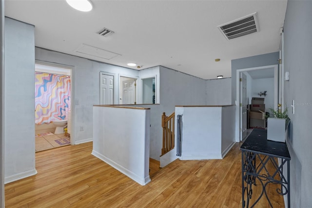 hall with light hardwood / wood-style floors