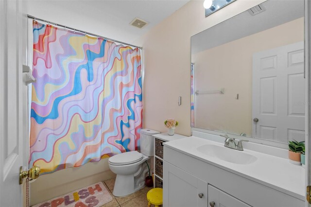 full bathroom featuring vanity, tile patterned floors, shower / tub combo, and toilet