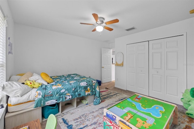 bedroom featuring carpet, a closet, and ceiling fan